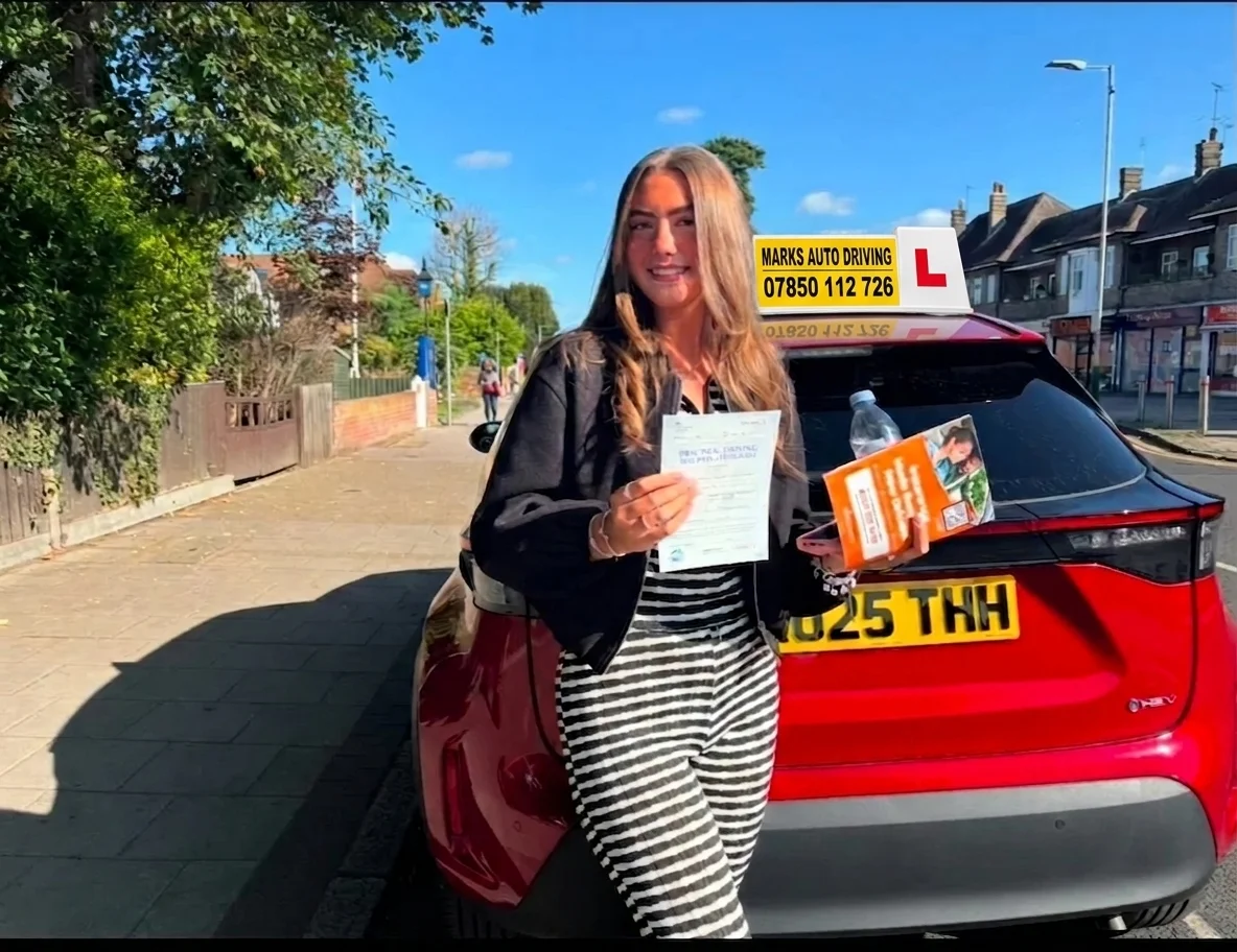 Marks Auto Driving student and instructor with L-plate automatic hatchback car